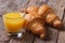 Continental breakfast: orange juice and croissants