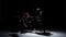 Continue of contemporary dance performance of five dancers on black, shadow