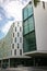 Continued and wavy gray facade of Vicki Sara Building with array of rectangular colorful windows, University Technology Sydney UTS