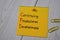 Continuing Professional Development write on sticky note isolated on wooden table