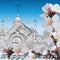 Contour image of the domes of the Church against the sky, birds, flowering branches and happy Easter words
