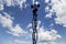 Contour small military radar station on background beautiful clouds and sky. Mobile relay station, Russia