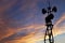 Contour small military radar station on the background of the sunset orange sky. Mobile relay station, Russia