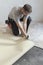 Contractor removing an old linoleum flooring