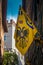 Contrade Aquila - Eagle flag hanging on the narrows streets in the old city center of Siena