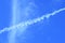 Contrail of airplane on blue sky