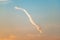 Contrail in evening sky