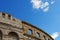 Contrail of the jet plane above ancient Roman amphitheater in Pula, Croatia