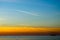 Contrails of aircraft in the blue sky at sunset