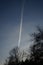 Contrails, condensation trails, against the blue sky. Berlin, Germany