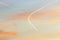 Contrails from several airplanes at sunset
