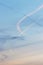 Contrails from several airplanes at sunset