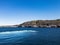 Contrast beautiful scene with green island between bay of sea and blue sky