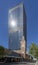 The contrast between the brick church and the tall glass skyscraper reflecting the rays of the sun, Perth, Australia