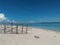 the contrast of the color difference between the white sand and the blue sea