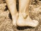 Contrast line on barefoot legs show socks  border, dusty skin