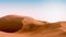 Contrast orange dunes and blue sky. Desert landscape with contrast skies. Minimal abstract background. 3d rendering