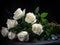 Contrasting Beauty: A Striking Still Life of White Roses on a Black Table