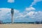 Control Tower at the Airport on Partially Cloudy Sky