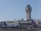 Control Tower at the Luis MuÃ±oz Marin International Airport witn planes loading passengers