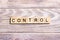 CONTROL word made with building wooden blocks