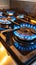 Controlled intensity Gas stove burner displaying a striking, blue flame