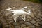 Controlling the flight of a drone with the help of transmitters a man holds in his hands and monitors the flight on the tablet