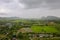 Conutryside with hill, house, land, river and cloud