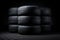A convenient and efficient way to store tires, this stack of tires sits on top of a sturdy brick floor., New tires pile on a dark
