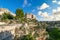 The Convent of Saint Agostino sitting on a steep cliff ledge overlooking a canyon with sassi cave prehistoric homes in Matera, Ita