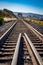 Converging railroad tracks along the ocean coastline