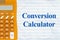 Conversion Calculator message with a calculator on lined paper