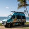 Converted Sprinter Van Parked on a Secluded Beach with Ocean View