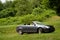 Convertible Parked in Field