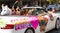Convertible with unicorn and Babylon Pride makes us strong written on car during Pride parade