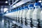 Conveyor for bottling milk into bottles at a modern dairy plant. Line for bottling and packaging of dairy products. Industrial