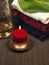 Convolute towels and candle