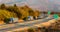 Convoy of blue lorry trucks on a highway