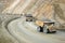 Convoy of Large dumptruck in copper mine