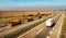 Convoy of Orange Tank trucks or Cisterns on a Highway Road traffic on a countryside highway