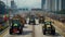 A convoy of tractors with activated lights participating in a rally on a busy urban road.