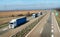 Convoy of transportation trucks on a highway