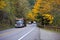 Convoy of trucks on the beautiful autumn highway