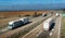 Convoys of transportation trucks passing on a highway