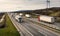 Convoys of transportation trucks passing on a highway