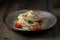 Coocked egg noodles with tomatoes and basil