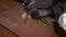 Cook in black rubber chef gloves cuts fresh onions on a cutting board in a restaurant kitchen. The concept of cooking.