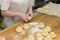 Cook cooks small pies in production, dough