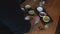 Cook creating a traditional Mexican dish in a bowl. Man adding sauces, herbs and fresh vegetables into one bowl on the