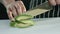 Cook cuts half of the avocado into slices. Slowmotion